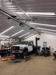 Work Shop Garage with truck being fixed under NuGen LED Solutions 8FT Linkable Integrated Lights Strips